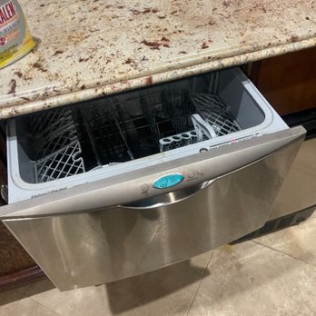 An open drawer-style dishwasher photographed during service.